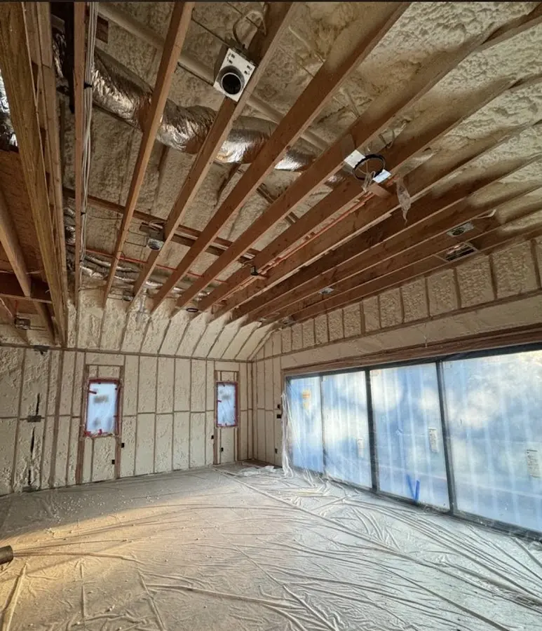 Interior walls and ceiling insulated with spray foam during new construction in La Porte